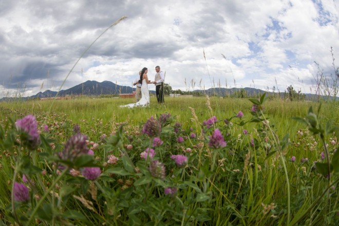 Allyssa and Glenn are married amongst the clover and tall grasses in Taos, NM