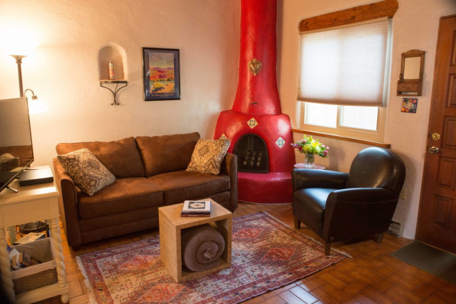 Photos of rental home with tile floor and kiva fireplace in Taos, NM