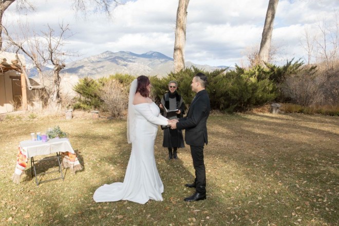 Maya and Robert married under the cottonwoods and in front of Taos mountains in Taos, NM.