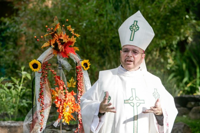 Priest gives outdoor ceremony in the sacred circle at El Monte Sagrado