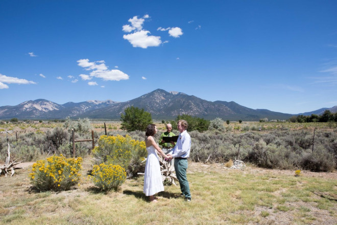 Gorgeous Taos wedding with natural setting of chamisa, sage, and Sangre de Cristo mountain range