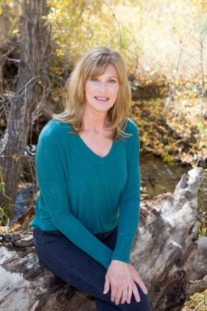 Professional headshots of Taos realtor in autumn in Carson National Forest