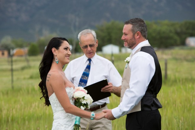 Allyssa and Glenn smile at one another during their evening elopement in Taos, NM