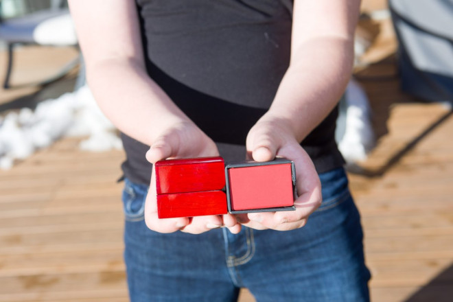 Celeste's 10 year old son, the ringbearer, holds the wedding ring boxes
