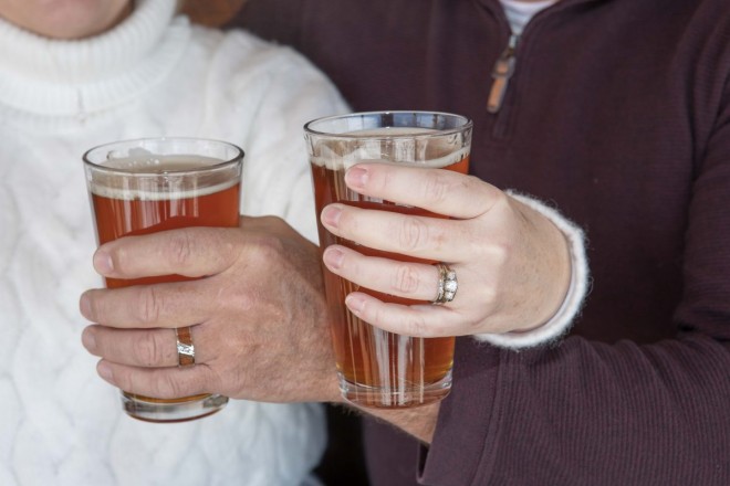 Wedding photograph of wedding rings and beers at micro-brewery in Eagle Nest, NM