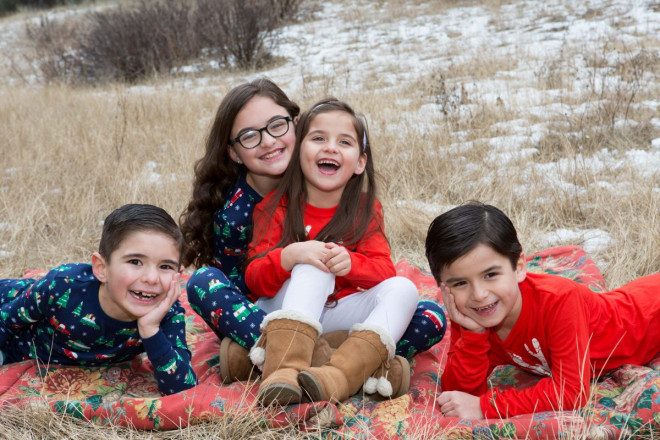 Snowy pajama photo shoot of cousins in Angel Fire, NM