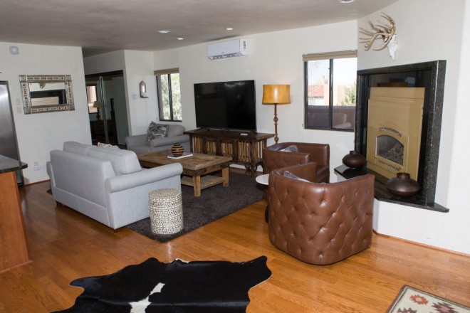 Living room and tv area in Quail Ridge condo in Taos, NM