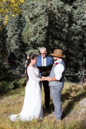 Sarah and Edwardo listen to the officiant during their wedding elopement