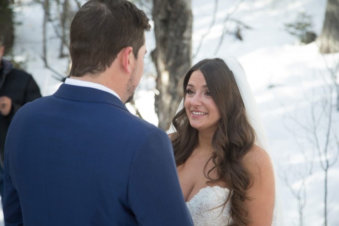 Kiersten wears a sleeveless wedding dress in the snow covered mountains