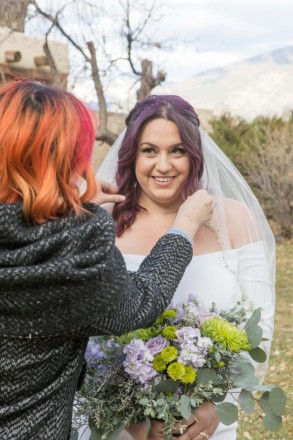 Lovely bride with purple hair and maid-of-honor with red and orange hair.