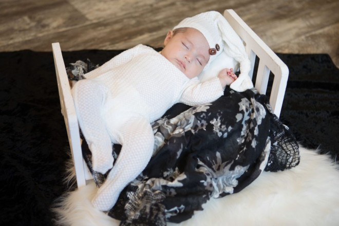 Sweet baby Tiana take a catnap during her four week newborn photo session