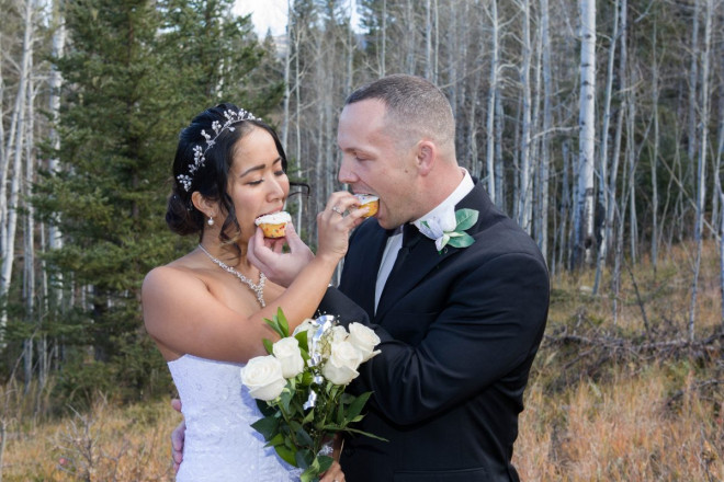 Chisato and Matthew feed one another wedding cake, or Hostess cupcakes