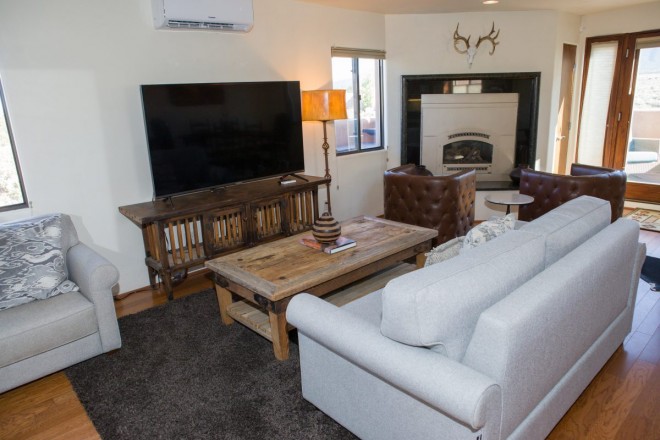 Sitting area in condo with wood floors near Taos Ski Valley
