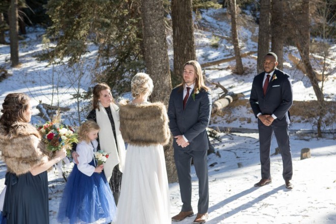 The ladies wore furs and the guys wore suits at this Red River wedding ceremony