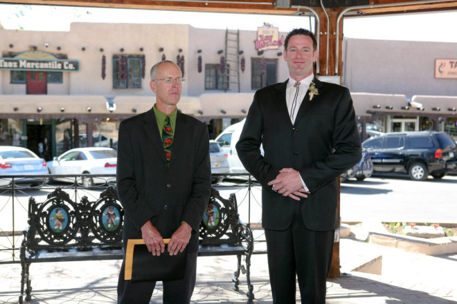 Taos plaza with chile ristras and pueblo style adobe buildings make nice wedding backgrounds