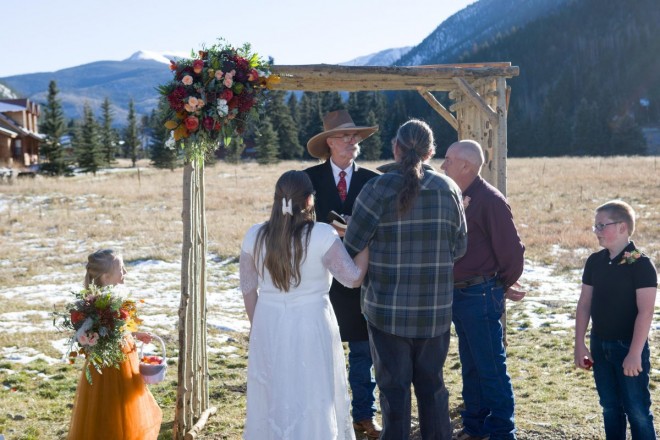 Celeste's father delivers her to Joe at their mountain wedding