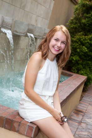 The fountains at Hotel Albuquerque are photogenic in this senior session with Bryna wearing white.