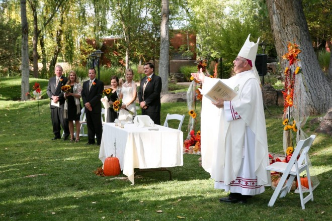 Outdoor priest blesses the sacred circle at El Monte Sagrado before presiding over the wedding ceremony