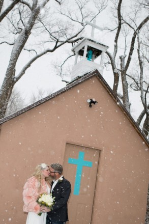 Methodist Church with turquoise accents in Taos, NM snow