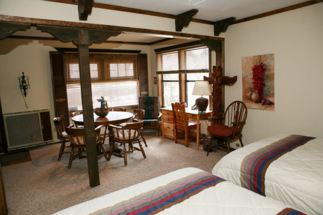 Bedroom with two double beds at Casa Sierra