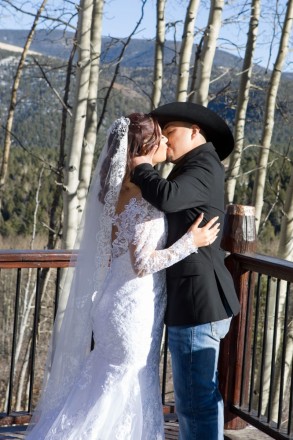 Alysa and Ty kiss to seal their vows at their Angel Fire outdoor wedding