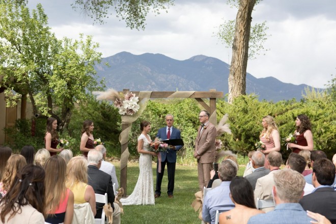 Outdoor May wedding with fifty guests and Taos mountain