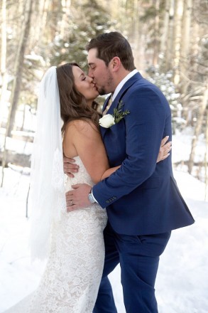 Kiersten and Andrew seal their wedding vows with a kiss!