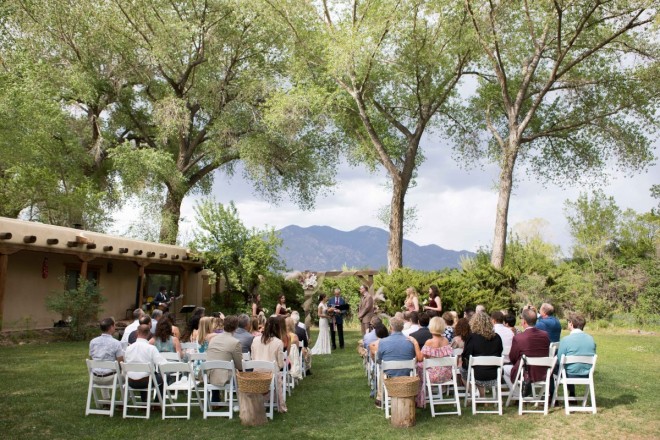 Taos Mountain and the Cottonwoods overlook this small outdoor wedding