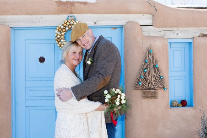 Popular "Taos Blue" and stucco makes a beautiful background for December wedding