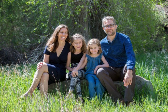 Alana Benjamin and her family smile for a family photo session in Taos
