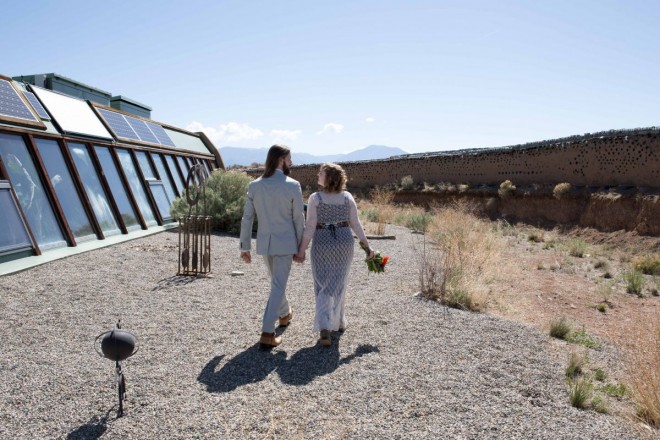 A little stroll around the Earthship as the bride and groom walk hand in hand