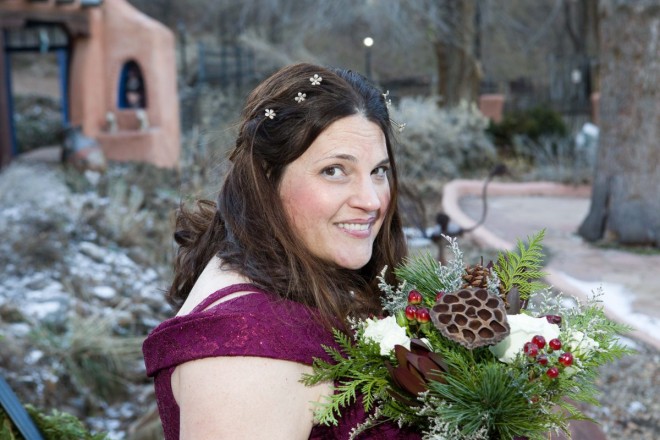 Wintertime bridal portrait with greenery bouquet and background of snowy sagebrush