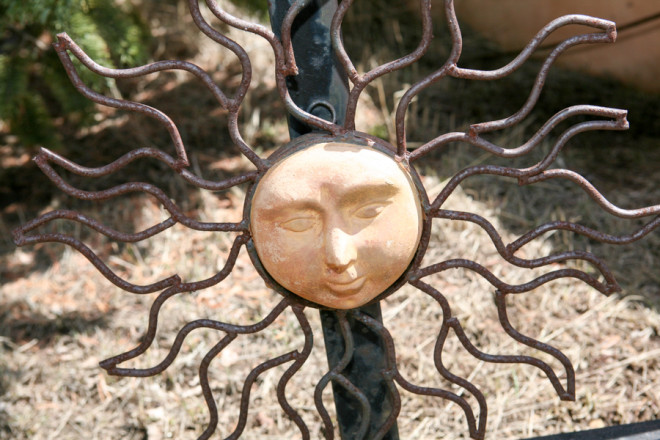 Sunshine hanging on gate at Sierra Casa in Taos Canyon