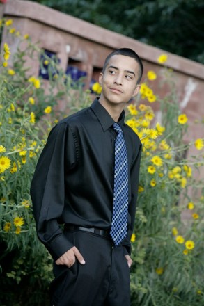 August wildflowers adorn the background of the Taos High School senior photo