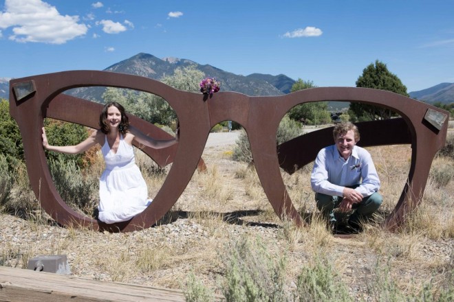 Sculpture garden picture with Katy and Daniel and Taos mountains
