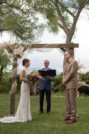 Lindsay and John are married outdoors in May in Taos