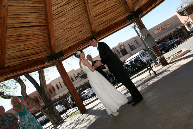 Wedding under latillas of the plaza gazebo in Taos, NM