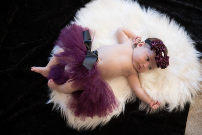 Baby Tiana rocking a tutu and headband on her heart faux fur
