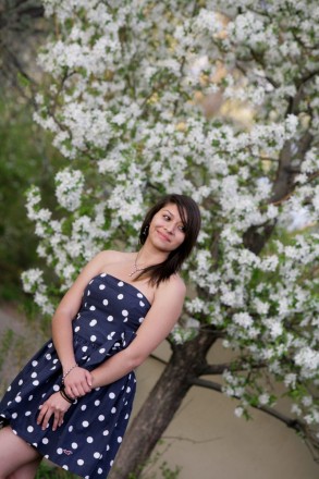 Espanola senior poses with spring blossoms before high school graduation in May