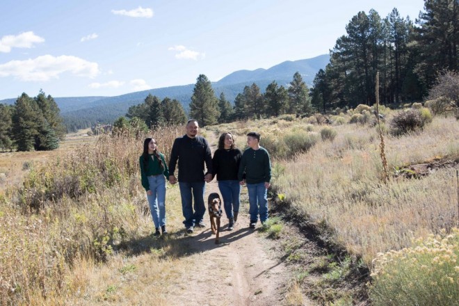 Family + Doberman walking in the mountains of Angel Fire