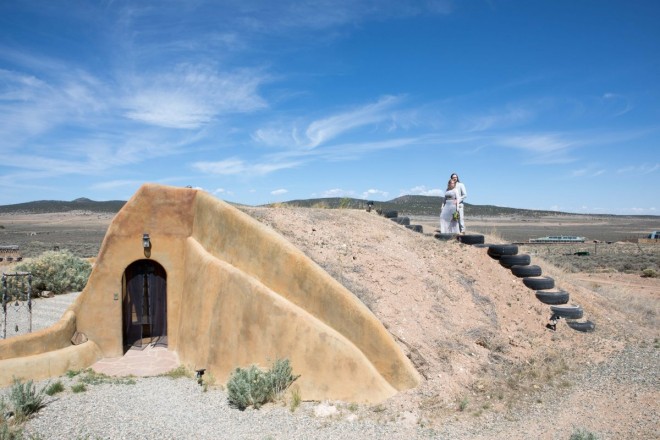 Earthship home in Taos, NM with recycled tire stairs and mesa views