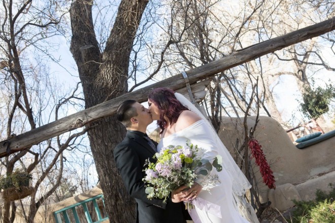 The bare Cottonwoods and the red chiles are the perfect background for this winter wedding.