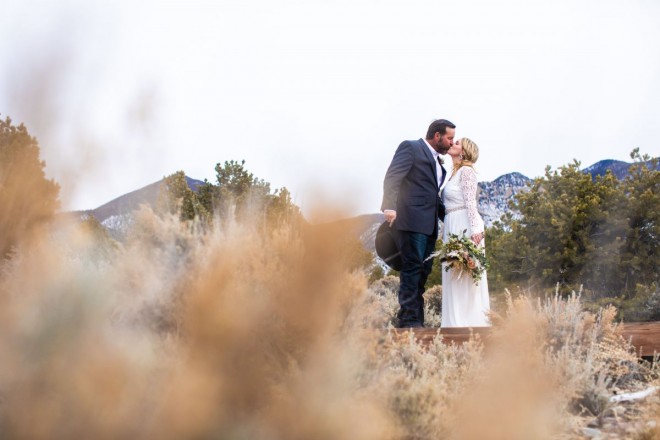 Wintertime wedding in Questa, NM with earth tone colors and snowy mountains