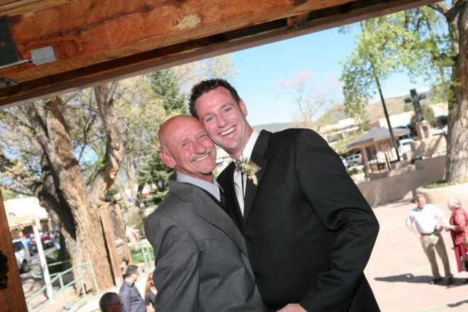 Groom smiles with his father on his wedding day in Taos