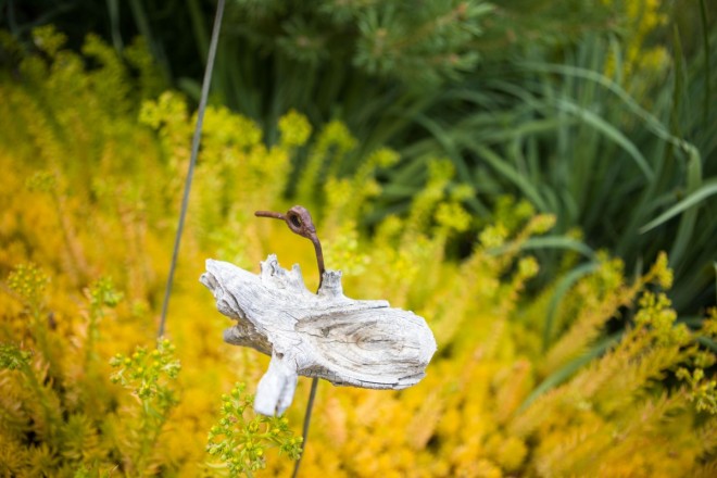 Ornamental bird sculpture in SpiriTaos garden