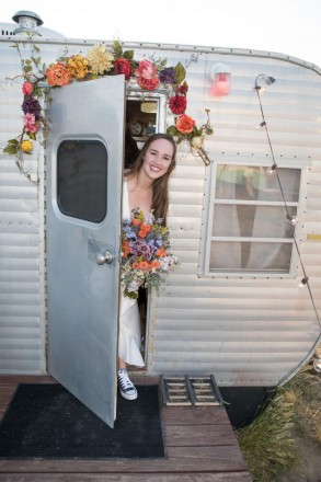 Allie peeks out of her trailer with her bouquet a few minutes before her 1st reveal photo