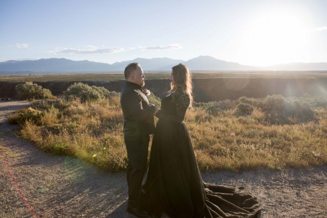Sunrise wedding in Taos, bride and groom in black
