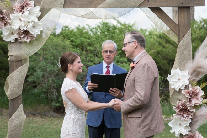 Officiant Dan Jones recites a customized wedding ceremony for John and Lindsay