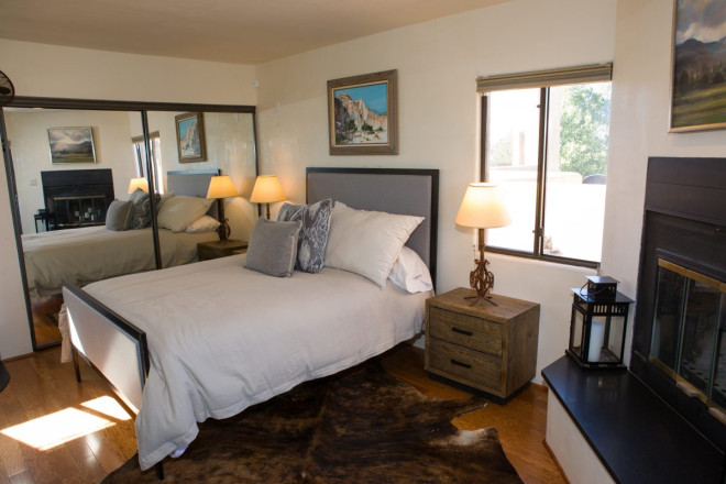 Master bedroom with large closet and fireplace at Taos rental