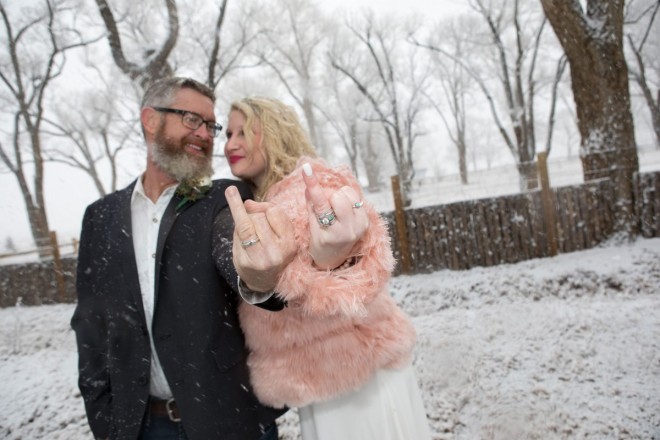 Manndi and Justin show off their wedding rings in Taos, NM